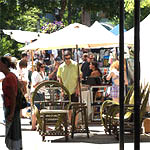 crowds check out the food booths at Eugene Saturday Market.