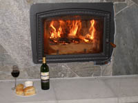 Wine and snacks in front of our wood-burning fireplace.