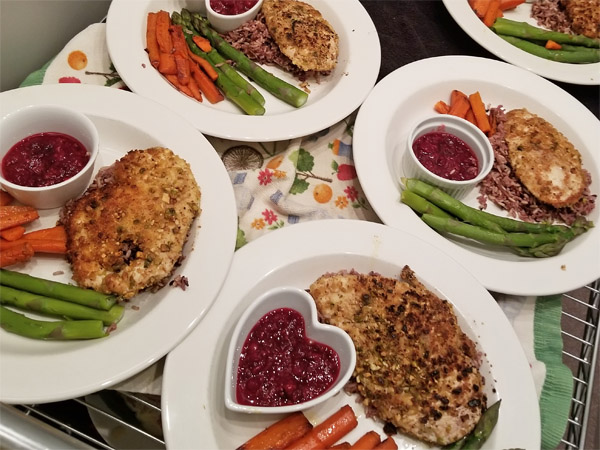 Nut crusted chicken and sides.